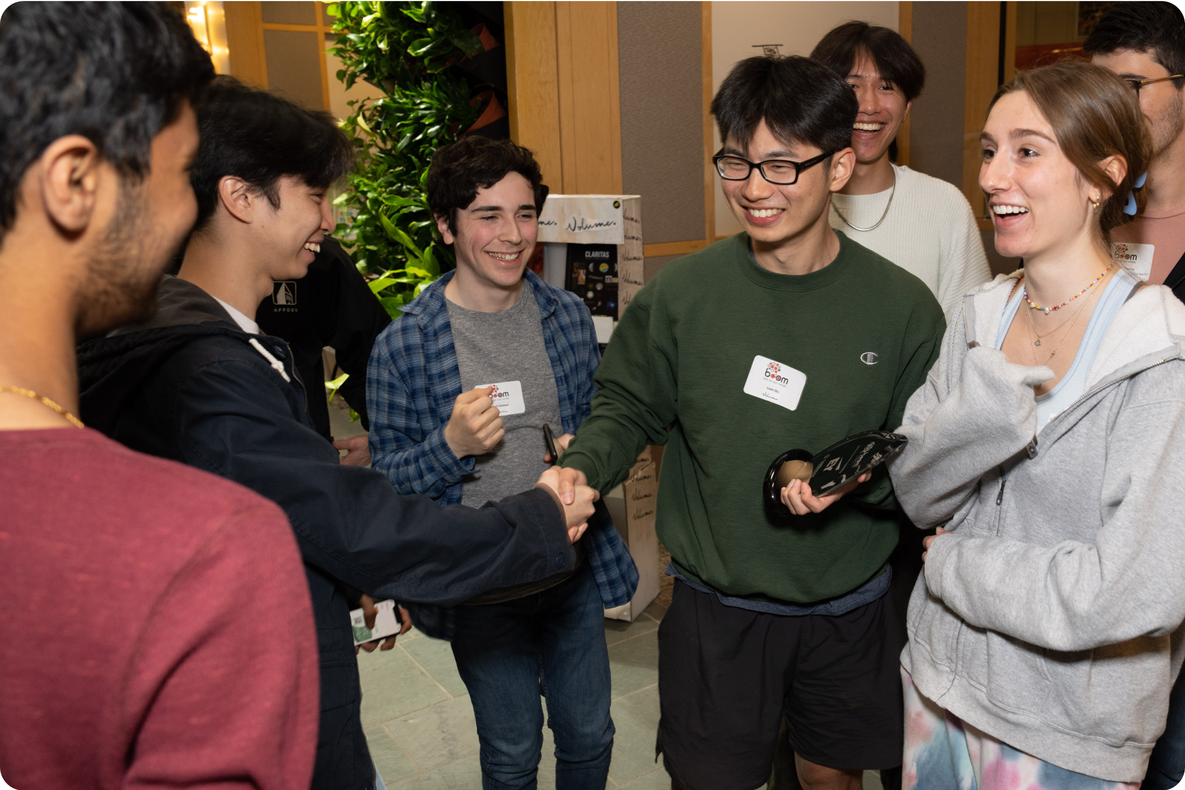 Shaking hands with my Product Manager, Liam Du, after receiving the BOOM award.